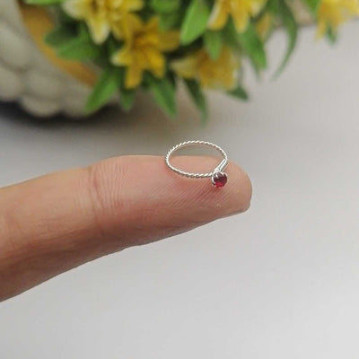 silver massionate stone twisted nose ring red stone