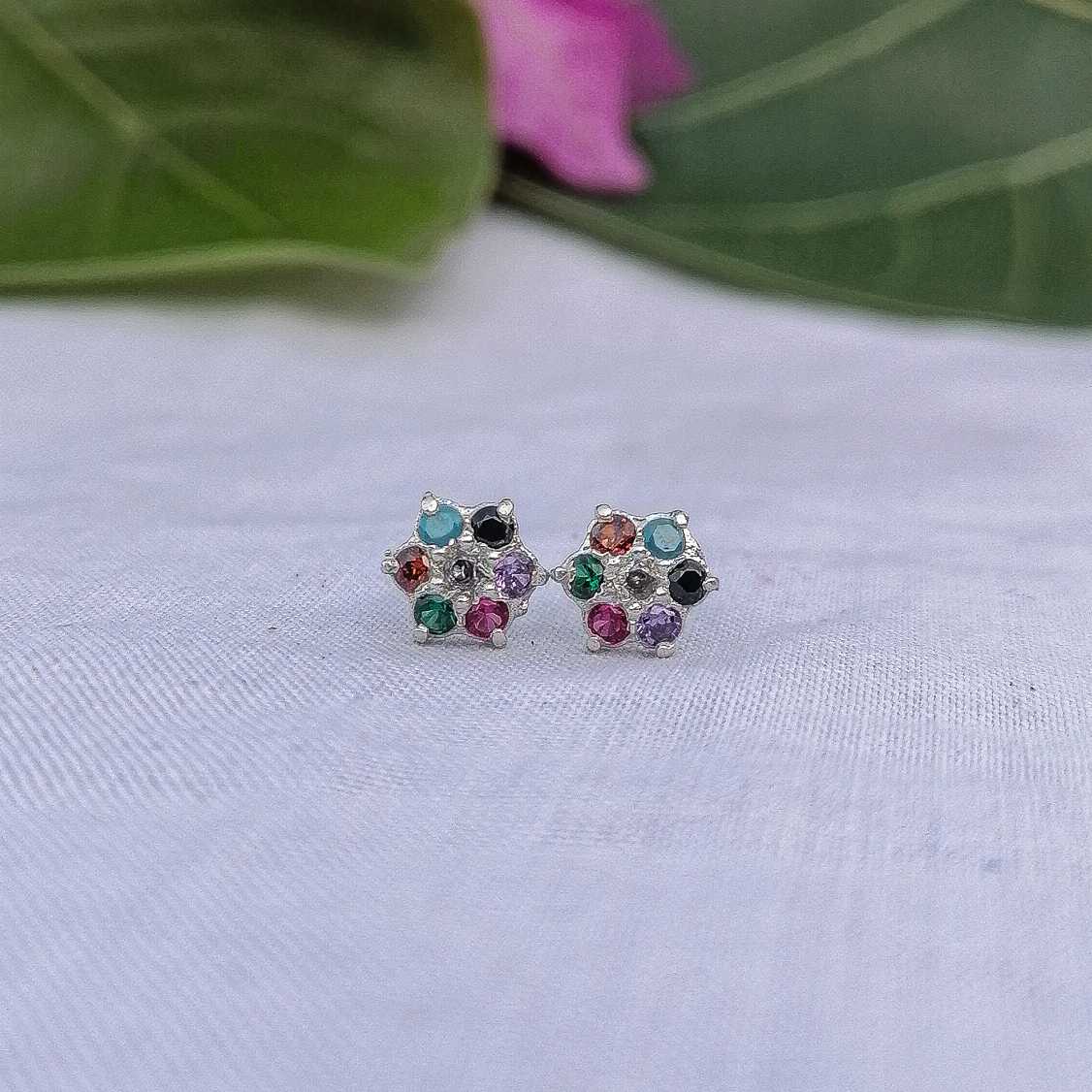 Pastel flower earrings displayed in a row soft colors for sensitive ears