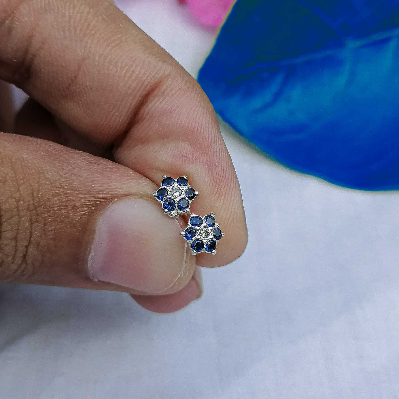 7mm blue flower stud worn on helix piercing 