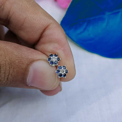 7mm blue flower stud worn on helix piercing 