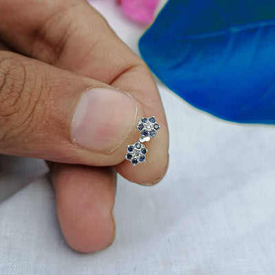 5mm blue chandi flower stud on lobe

