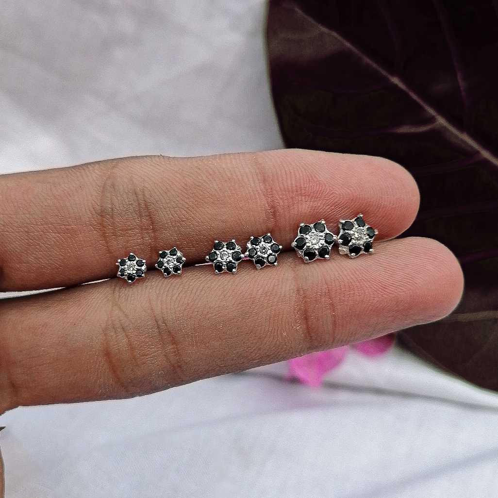 Silver black flower stud earrings in 5 mm, 7 mm & 9 mm on hand photo