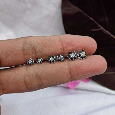 Silver black flower stud earrings in 5 mm, 7 mm & 9 mm on hand photo