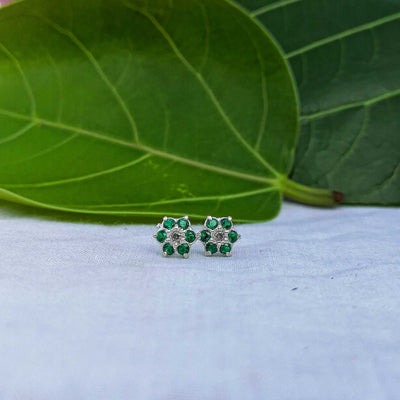 Small silver flower earrings with green petals

