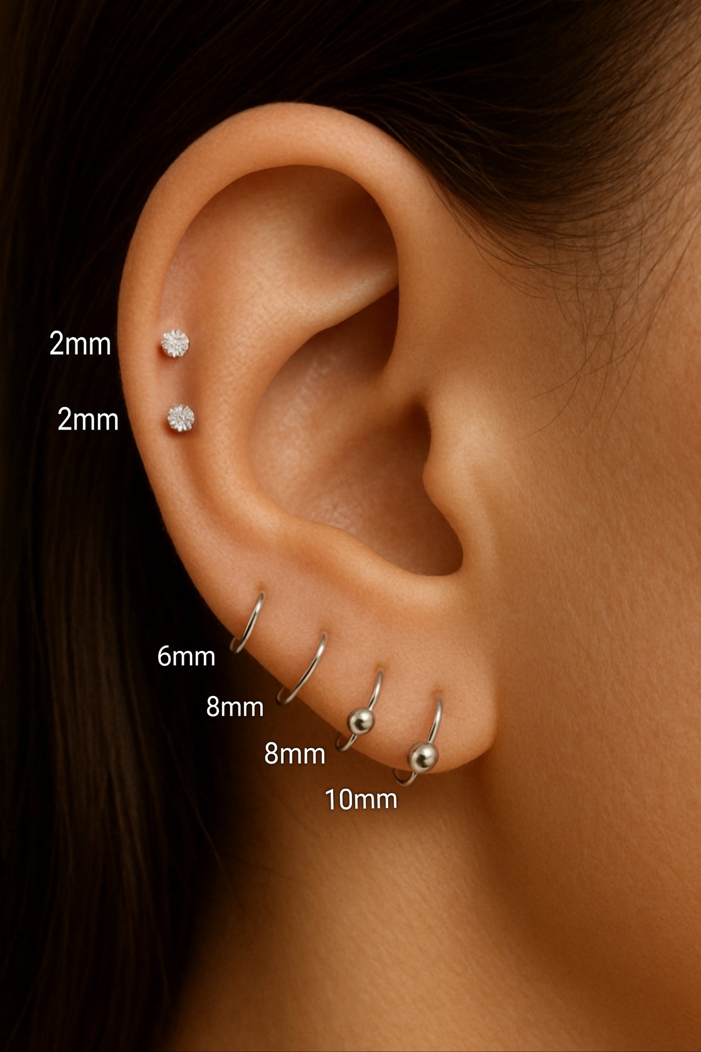 Close-up of ball stud in helix ear piercing